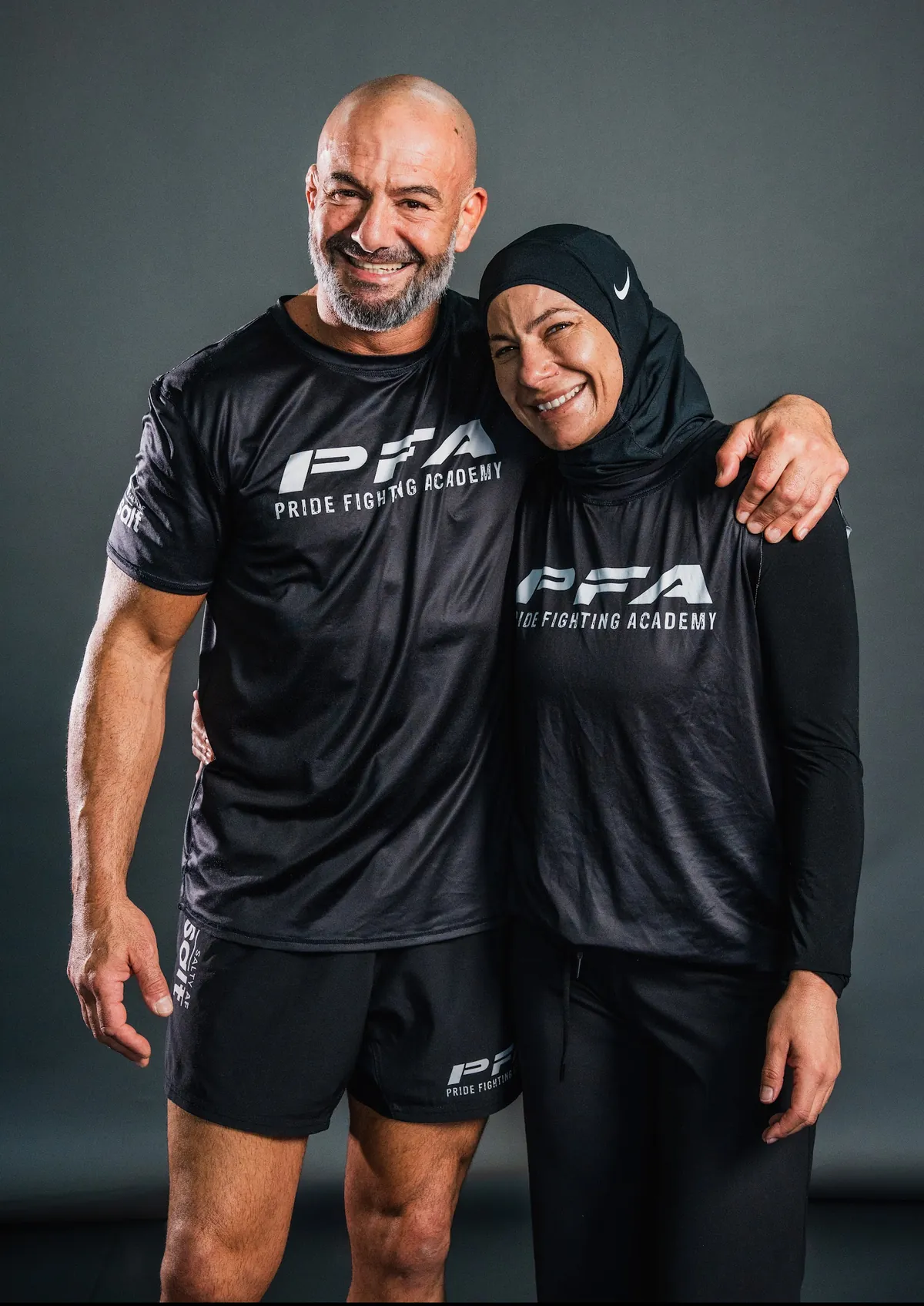 Mike and Jess Mouneimne, founders of Pride Fighting Academy, in PFA kit